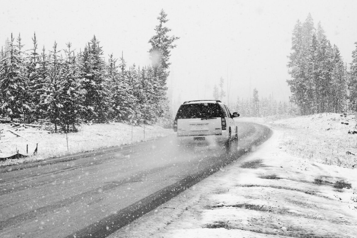 White SUV Driving in Wintertime