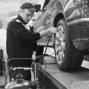 Mechanic Checking Tire Air Pressure